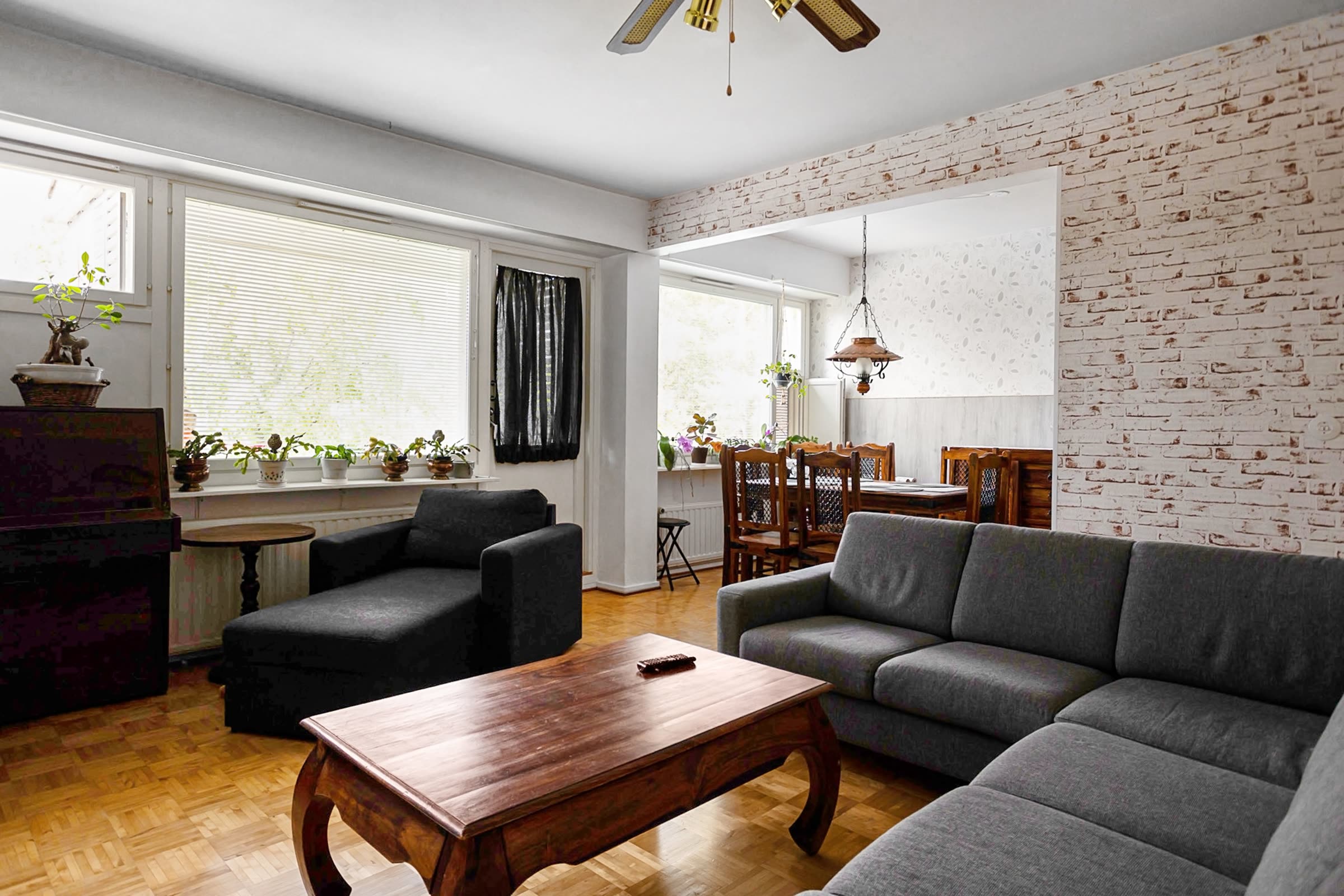 A lived-in living and dining space with natural light