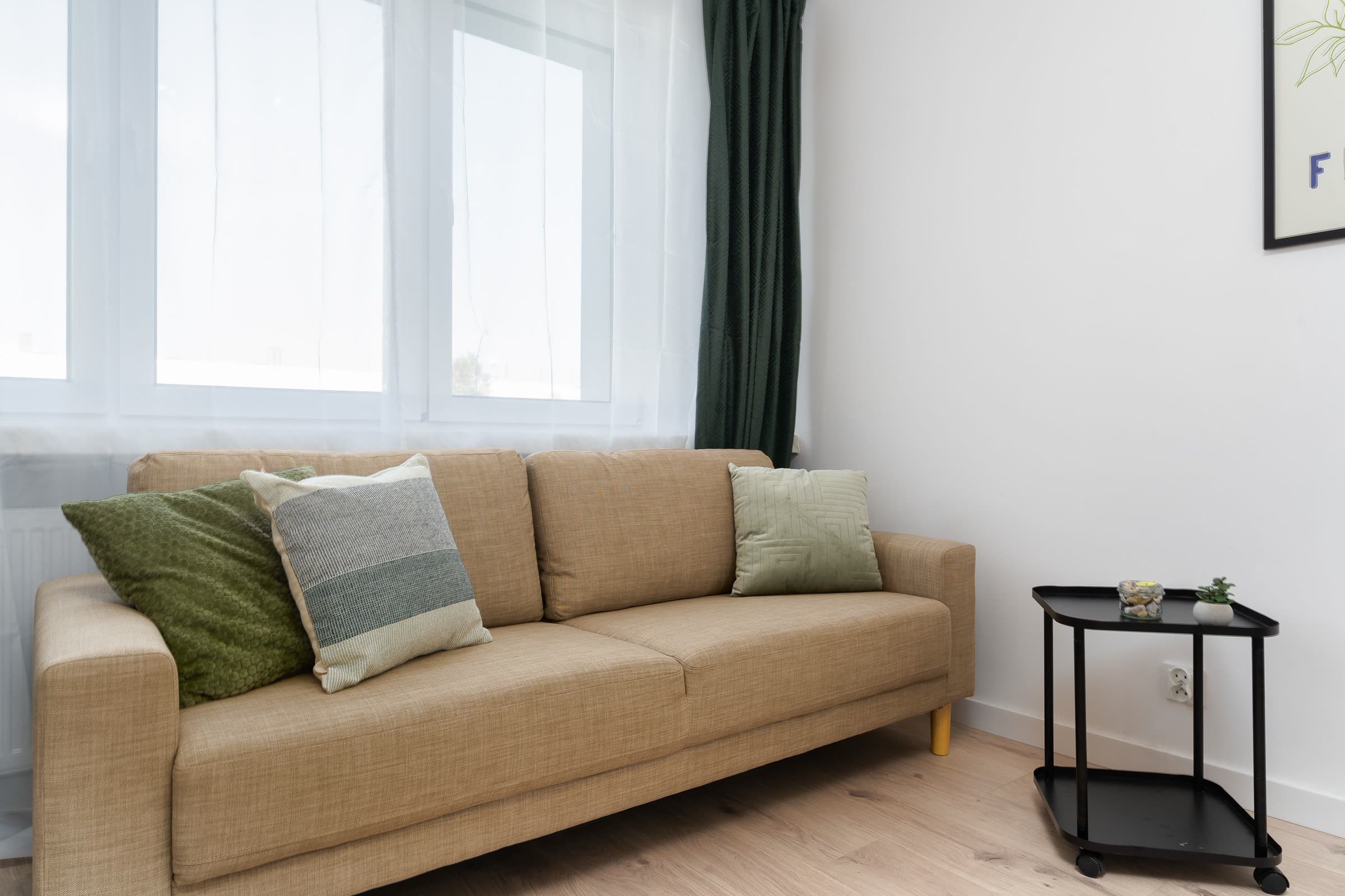 A calm, lived-in living room seating area in a client's home